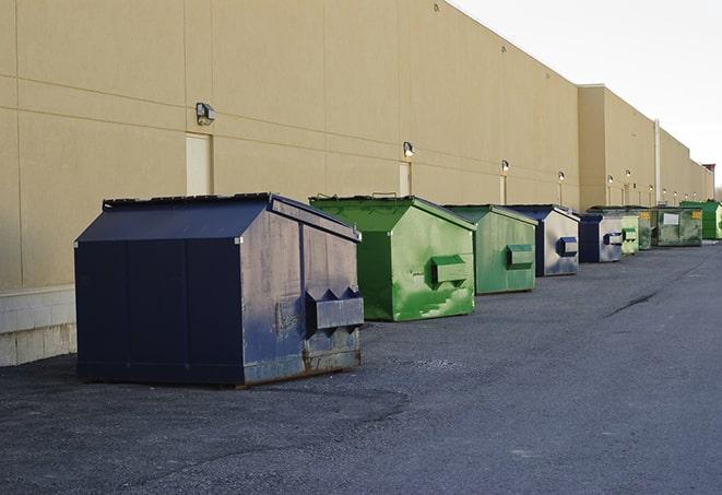 closed construction dumpster with a sign prohibiting unauthorized access in Broad Brook